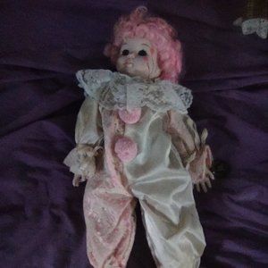 Musical porcelain clown doll